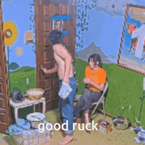 a man without a shirt is standing in front of a woman in a chair .
