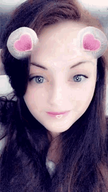 a close up of a woman 's face with a snapchat filter on