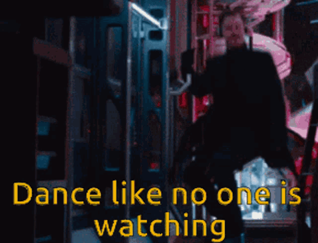 a man in a suit is dancing with the words dance like no one is watching