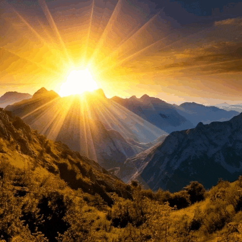 the sun shines brightly over a mountain range