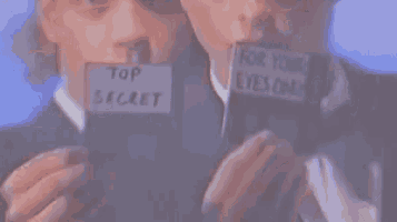 two men are holding a card that says top secret and for your eyes only