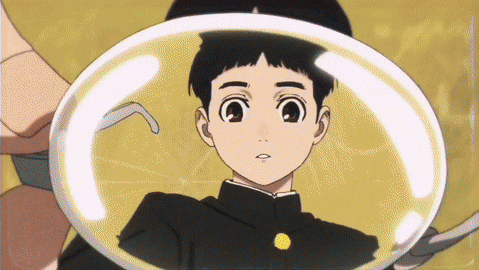 a boy with a yellow button on his chest is in a clear bubble