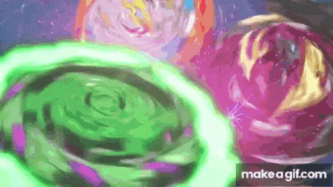 a group of spinning tops are spinning in a circle on a table .