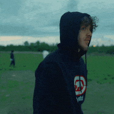 a man wearing a hoodie that says ecko unltd on it