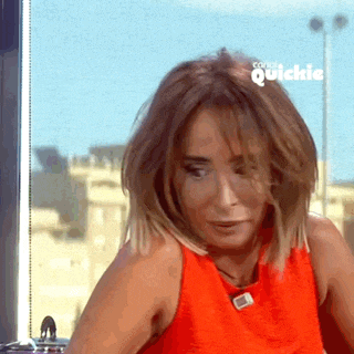 a woman in an orange tank top is sitting in front of a window with the words quickie on the bottom right
