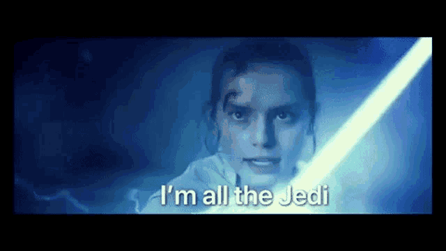 a close up of a woman holding a light saber and saying `` i 'm all the jedi '' .