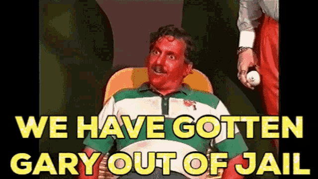 a man with blood on his face is sitting in a chair with the words we have gotten gary out of jail
