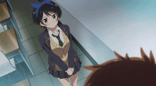 a girl in a school uniform with a blue bow in her hair stands next to a boy