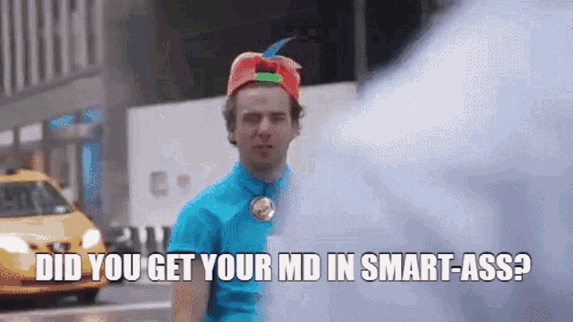 a man in a blue shirt and red hat says did you get your md in smart-ass