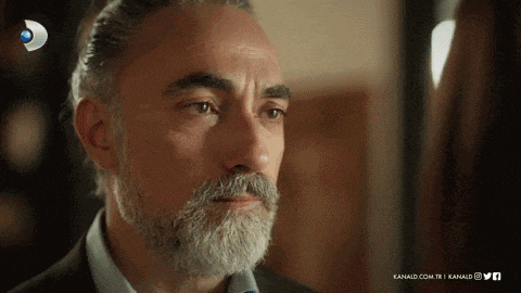 a close up of a man with a beard and mustache with the words kanald.com.tr on the bottom