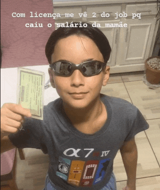 a boy wearing sunglasses and an x7 iv shirt