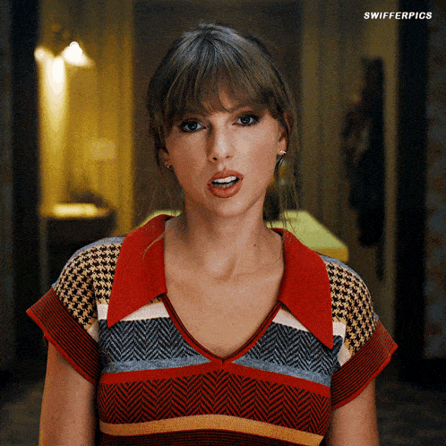 a woman wearing a striped shirt with a red collar