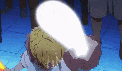 a person with yellow hair is holding a white object in front of their face