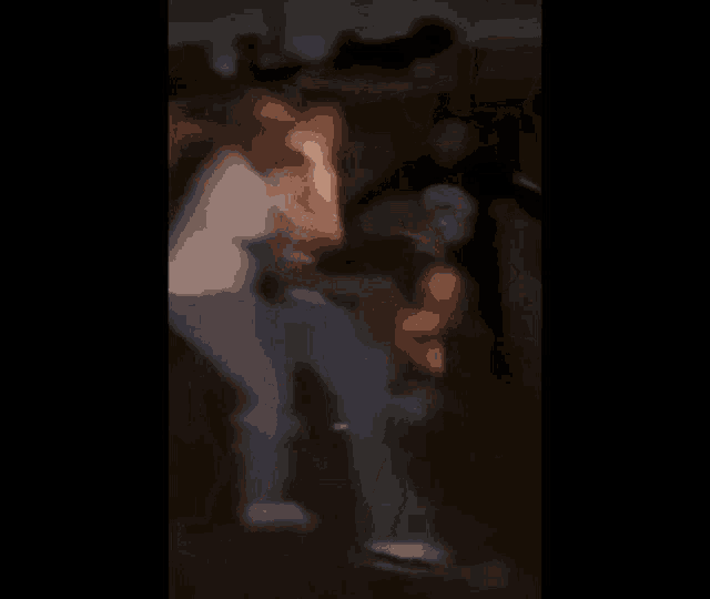 a blurry picture of a group of people dancing in a park .