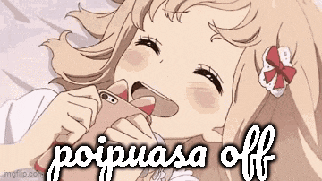 a girl is laying on a bed holding a cell phone in her mouth and laughing .
