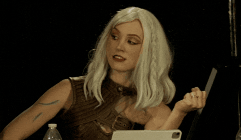 a woman in a wig is saying " mind fast "