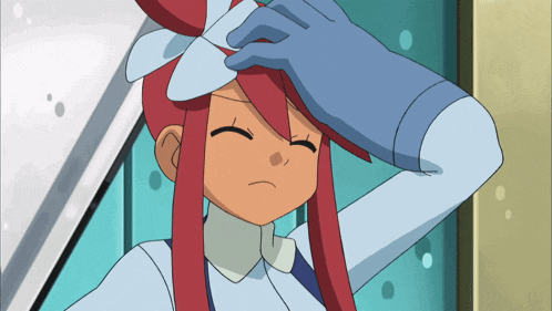 a girl with red hair and a blue glove holds her head