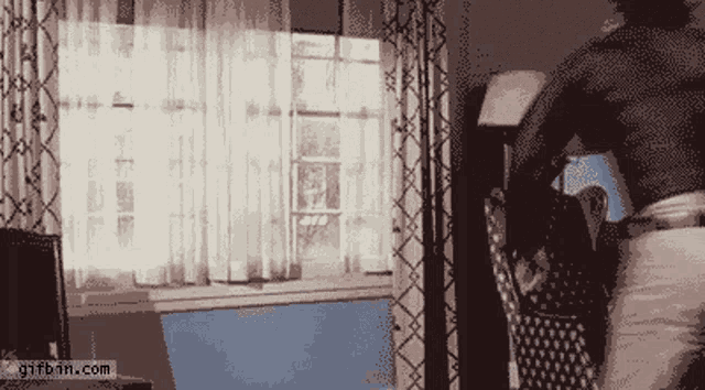 a pixelated image of a room with a gifbin.com watermark