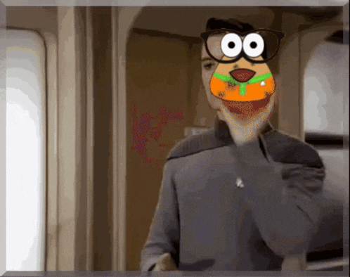 a man is wearing glasses and a cartoon dog mask on his face .
