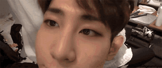 a close up of a person 's face with a watermark that says ' jongeumhyuk '