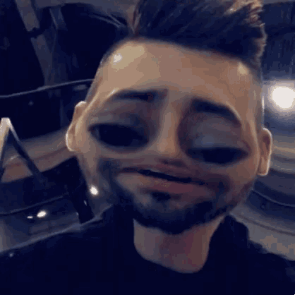 a man with a beard is making a cartoon face with his mouth open .