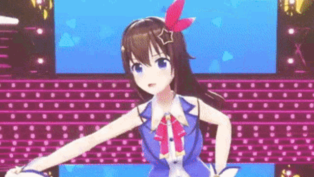 a girl in a blue dress is dancing on a stage in front of a screen .
