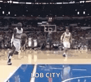 a basketball player is dribbling the ball on a court with the words lob city written on the bottom .
