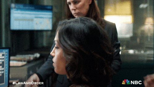 two women looking at a computer screen with the nbc logo on the bottom