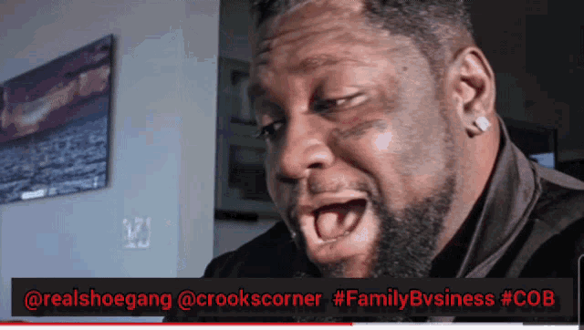 a man is making a funny face with a caption that says family business