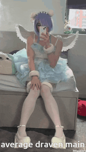 a person sitting on a bed taking a picture of themselves with average draven main written on the bottom