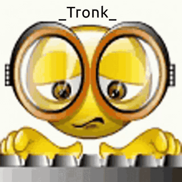 a yellow smiley face wearing glasses is typing on a keyboard