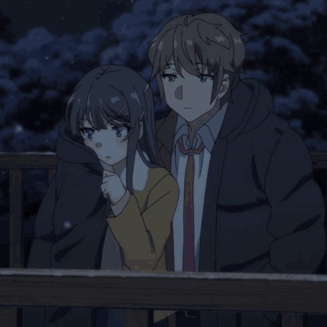 a boy and a girl standing next to each other