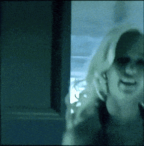 a blurry picture of a woman in a room