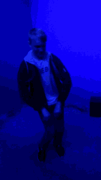 a man wearing a t-shirt that says eb on it