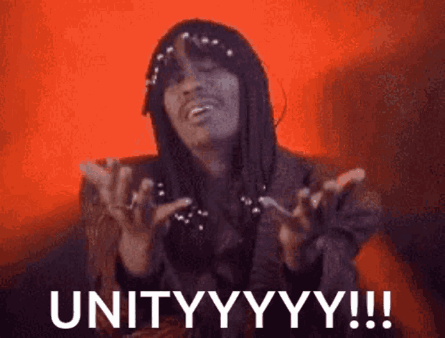 a woman is making a funny face and says unityyyy