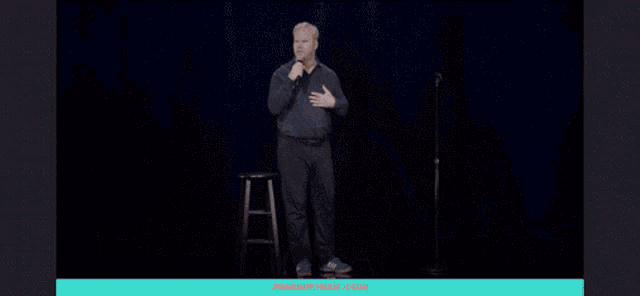 a man speaking into a microphone with the words " the f-o-l-i-a-g-e " on the bottom
