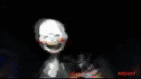 a blurred image of a person walking in the dark