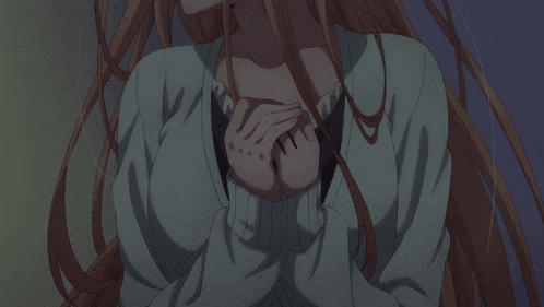 a close up of a girl 's face with long brown hair
