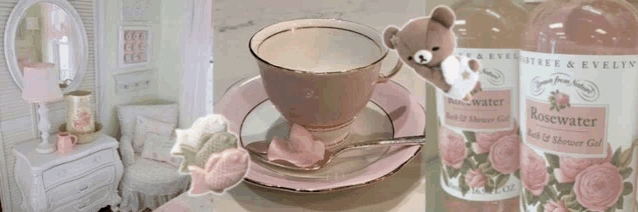 a bottle of rosewater sits on a table next to a cup and saucer