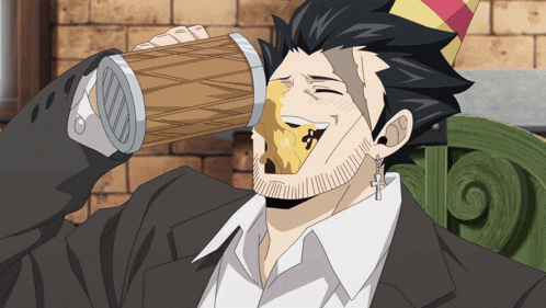a man wearing a party hat is drinking from a wooden cup