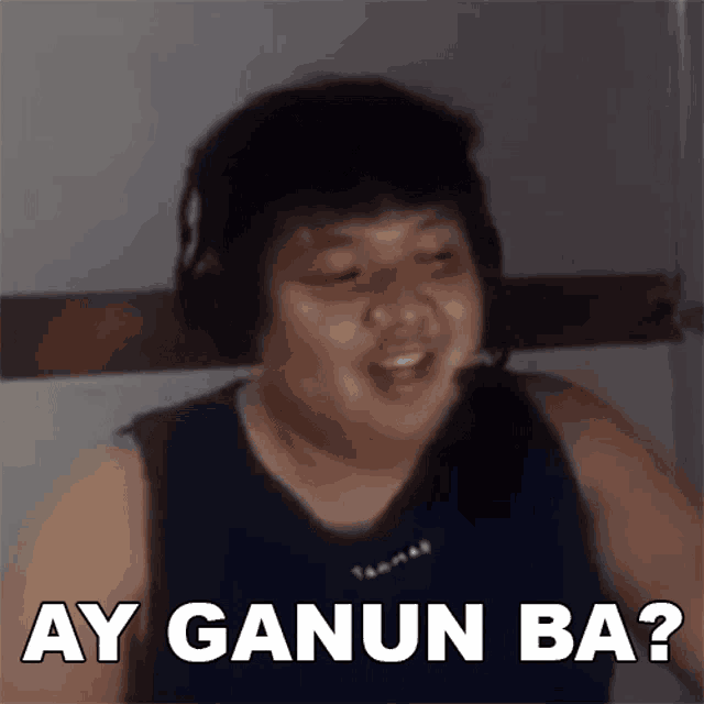 a man wearing headphones has the words ay ganun ba on his chest