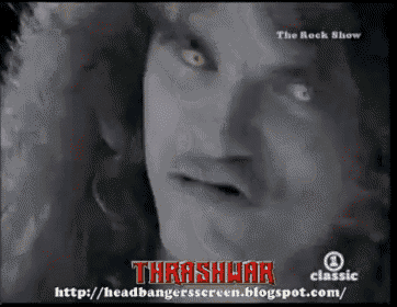 a close up of a man 's face with thrashwar written in red letters