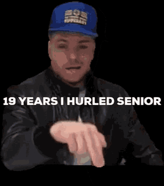 a man wearing a blue hat and a leather jacket says 19 years i hurled senior on a black background