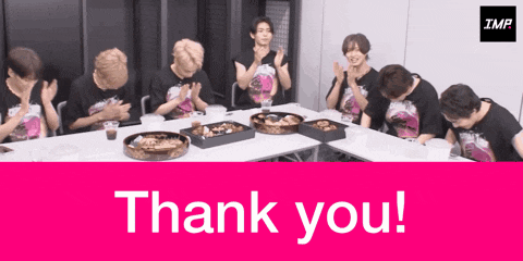 a group of people sitting around a table with the words thank you in the corner
