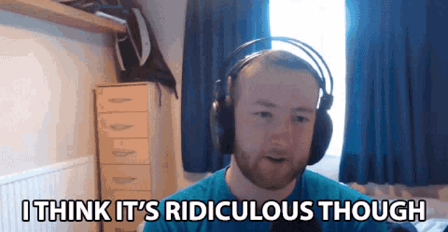 a man wearing headphones with the words i think it 's ridiculous though below him
