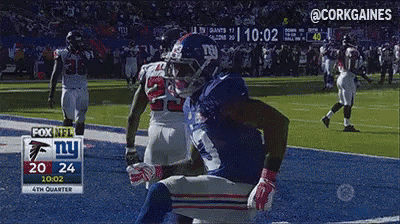 a new york giants player is running on the field