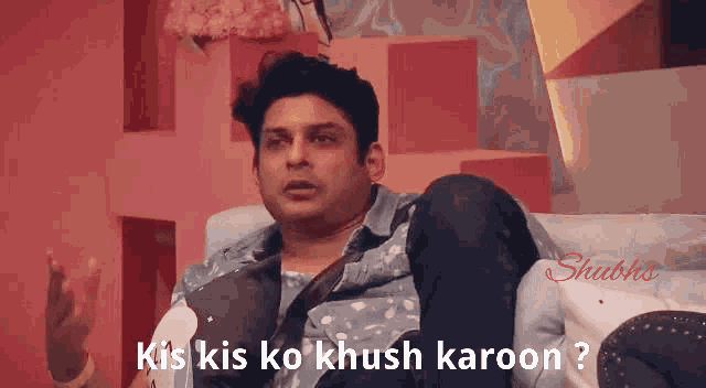 a man is sitting on a couch with the words kis kis ko khush karoon written on the bottom