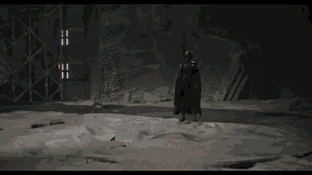 a video game character is standing in a dark room and talking to col kesis