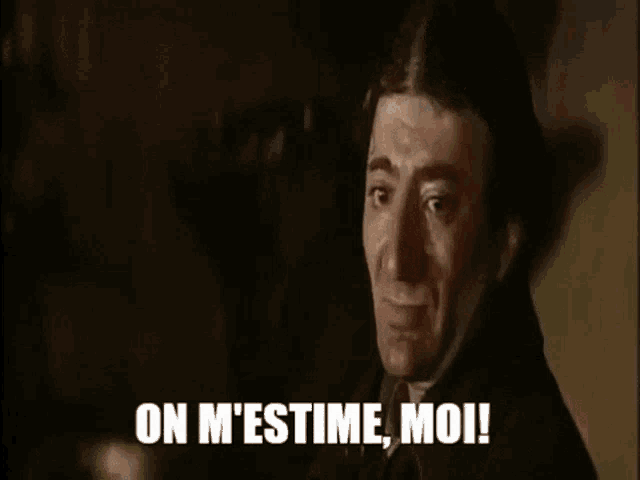 a man in a black suit is making a funny face and saying `` on m 'estime , moi ! ''