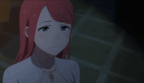 a girl with red hair and blue eyes is wearing a white shirt and necklace